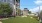 a building with a lawn and trees