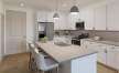 a kitchen with white cabinets